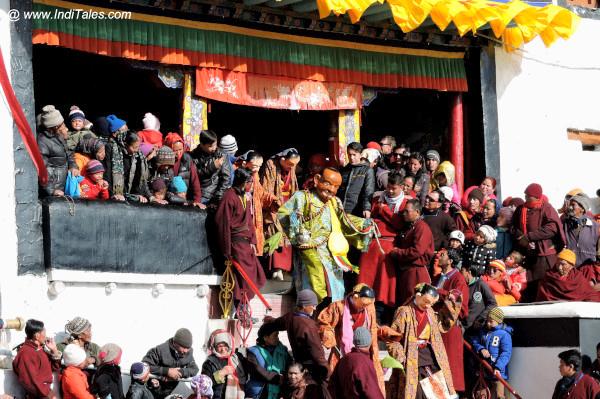 Masked dancers coming down to perform Cham Dance at Spituk Monastery, Ladakh