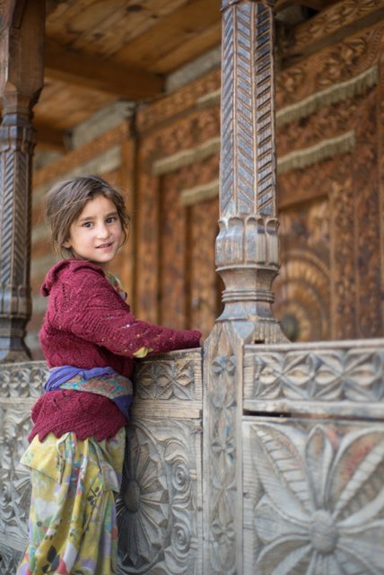 Girl at Malana Village & the wood carved buildings
